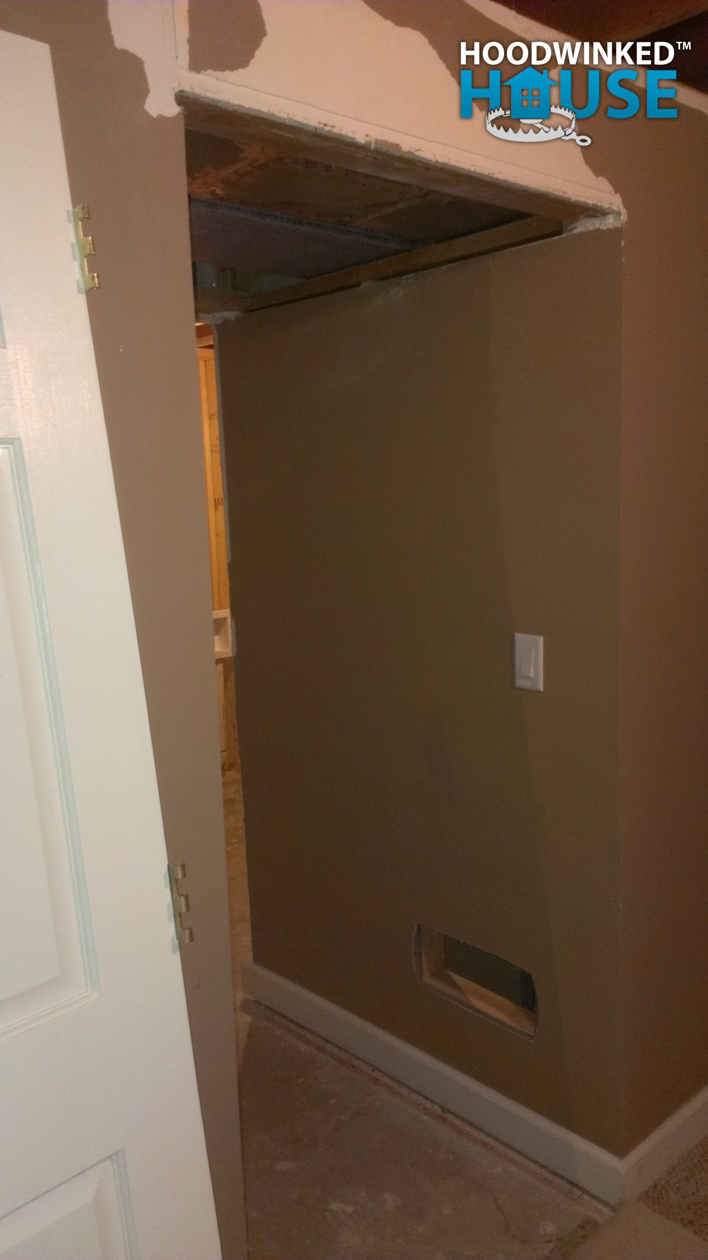 A ceiling duct is repaired with a patch, and a new cold air return is added installed in a wall near the floor.